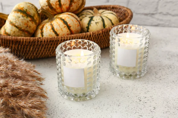 Glass Holders Burning Candles Basket Pumpkins Light Table Closeup — стоковое фото