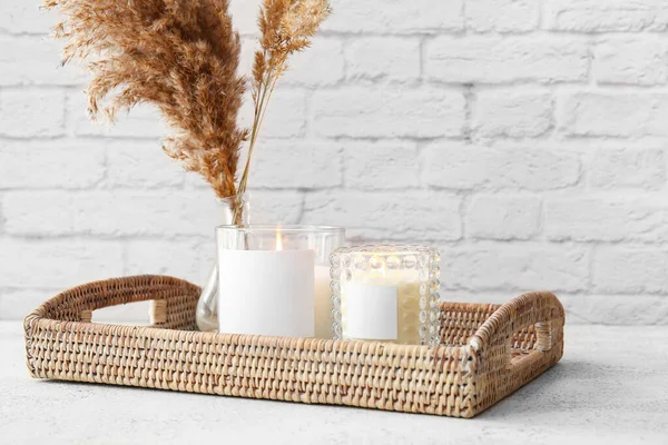 Wicker Tray Burning Candles Reed Flowers Light Table — стоковое фото