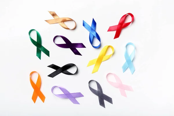 Different Scattered Awareness Ribbons White Background World Cancer Day Concept — стоковое фото