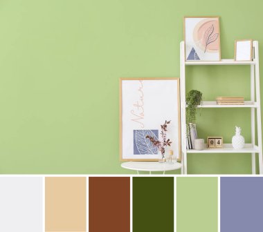 Şık dekorlu raflar ve yeşil duvarın yanında çiçek açan ağaç dallarıyla dolu bir masa. Farklı renk örnekleri