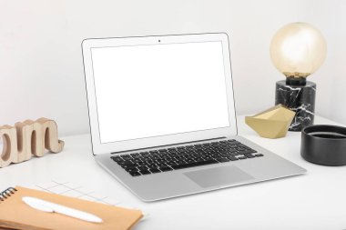Modern laptop on light table, closeup