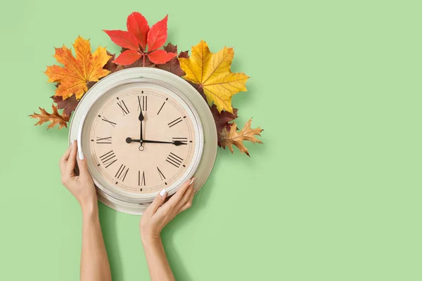 Female Hands Clock Autumn Leaves Color Background Daylight Saving Time — 스톡 사진