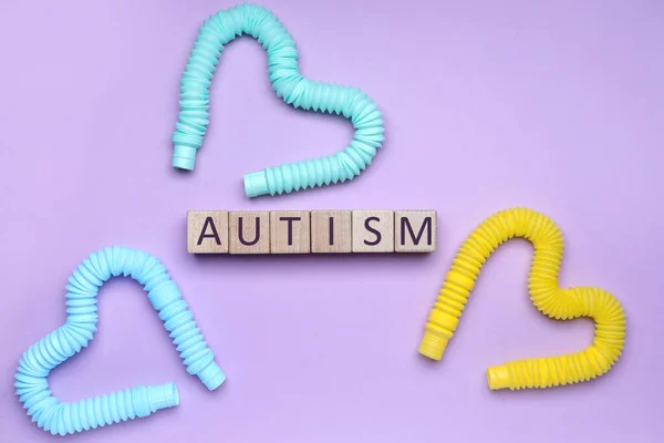 Word Autism Made Cubes Pop Tubes Lilac Background — ストック写真