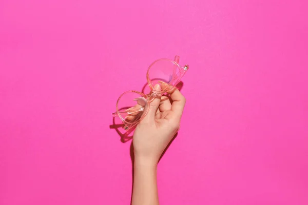 Female Hand Stylish Eyeglasses Pink Background — Stock Photo, Image