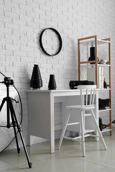 Modern Workplace Shelf Unit Different Equipment White Brick Wall Photo — стоковое фото