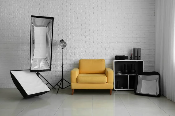 Comfortable Armchair Different Equipment White Brick Wall Modern Photo Studio —  Fotos de Stock
