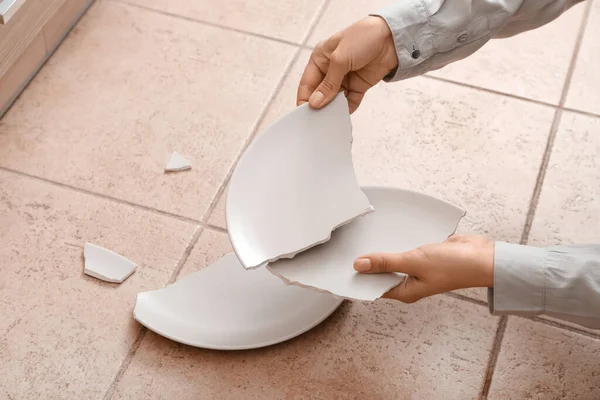 Woman Holding Pieces Broken Ceramic Plate Color Tile — стоковое фото