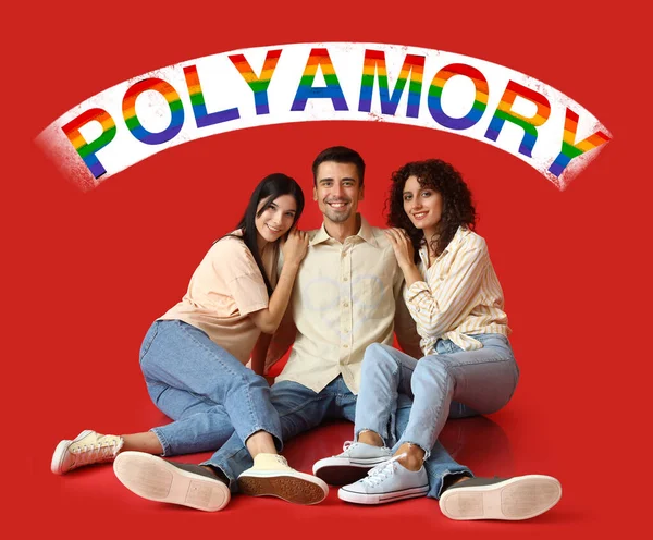 Man with two beautiful women and word POLYAMORY on red background