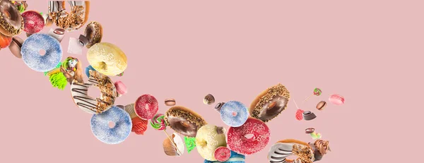 Many Flying Donuts Sweets Pink Background — Stock Photo, Image