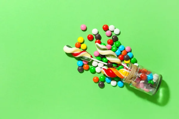 Glass Jar Lollipops Candies Color Background — стоковое фото