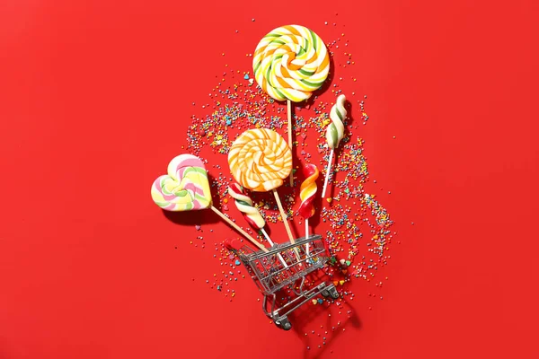 Composition Shopping Cart Lollipops Color Background — Foto de Stock