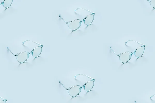 Mnoho Stylové Brýle Světle Modrém Pozadí — Stock fotografie