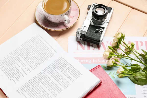 Books Cup Coffee Newspaper Flowers Photo Camera Light Wooden Background — Stock Photo, Image