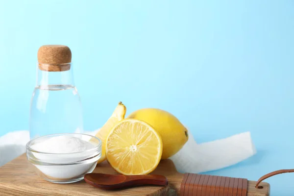 Wooden Board Bottle Water Baking Soda Ripe Lemons Color Background — Foto de Stock