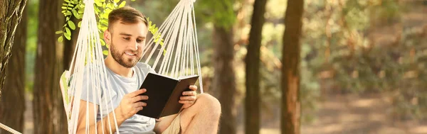 Young Man Reading Book Relaxing Hammock Outdoors — Stock Fotó