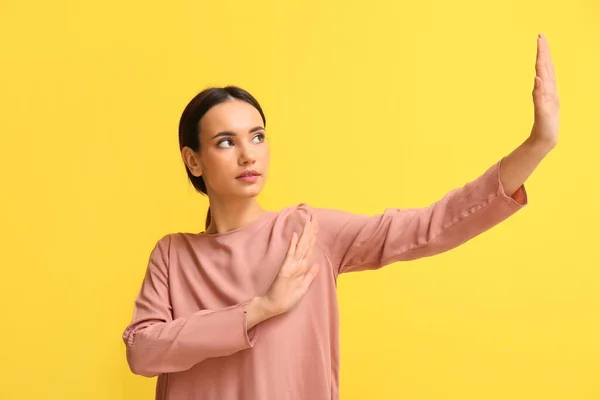 Young Woman Showing Stop Gesture Yellow Background Immunity Concept — Stock Photo, Image