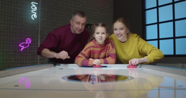 Happy Family Playing Air Hockey — Stockvideo
