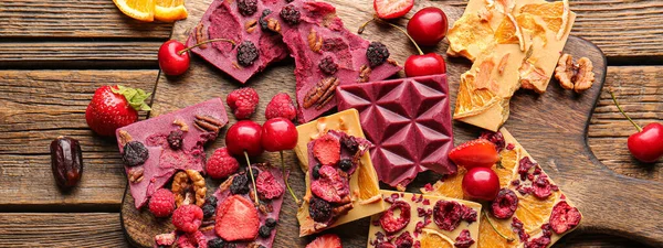 Tasty Chocolate Bars Fruits Nuts Wooden Background — Stock Photo, Image