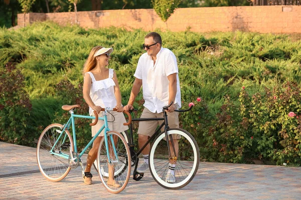 Mature Couple Bicycles Walking City Park Summer Day —  Fotos de Stock