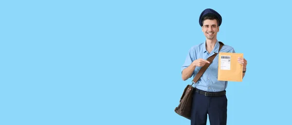 Handsome Young Postman Light Blue Background Space Text — Fotografia de Stock