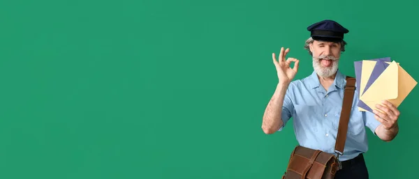 Handsome Old Postman Showing Green Background Space Text — Stock Fotó