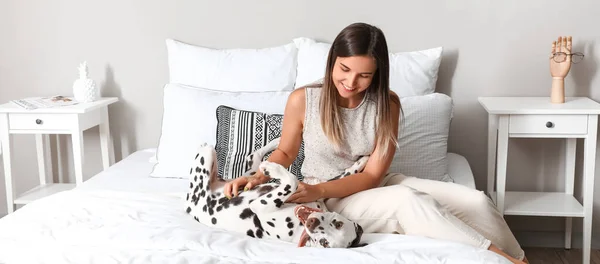 Young Woman Playing Funny Dalmatian Dog Bedroom — Foto Stock