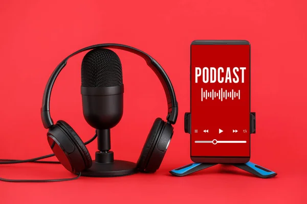 Microphone Headphones Mobile Phone Word Podcast Screen Red Background — Stockfoto