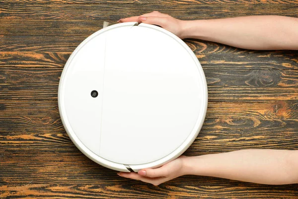 Woman Holding Robot Vacuum Cleaner Wooden Background Closeup — Foto de Stock