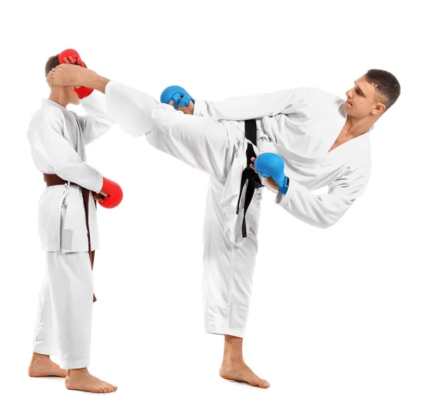 Junge Praktiziert Karate Mit Instruktor Auf Weißem Hintergrund — Stockfoto