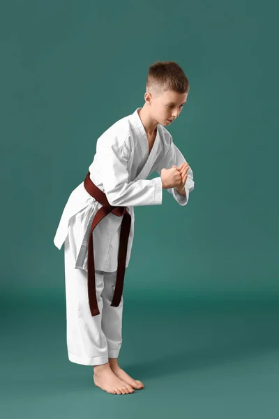 Boy Performing Ritual Bow Practicing Karate Green Background — Stock Photo, Image