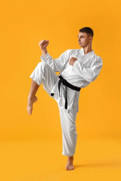 Man Practicing Karate Yellow Background — Stock Photo, Image