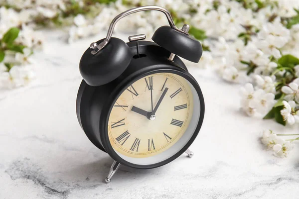 Blooming Spring Branches Alarm Clock Light Marble Background — Photo
