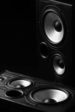 Modern loudspeakers on black background