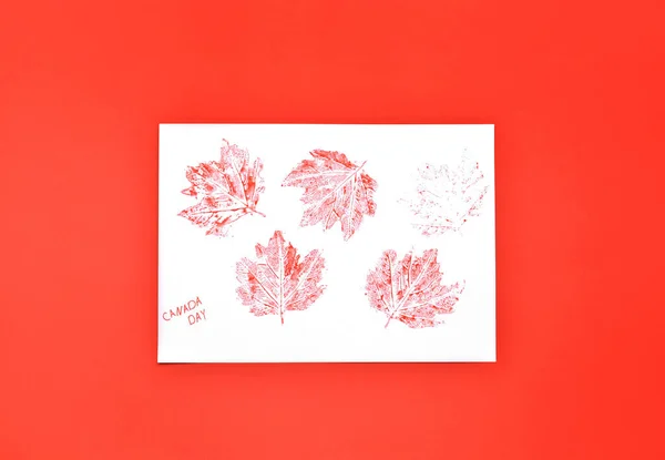 Paper Card Maple Leaves Text Canada Day Red Background — Stock Photo, Image