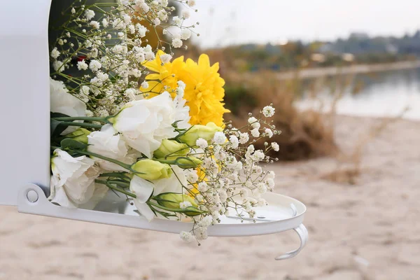 Mailbox with beautiful flowers near river