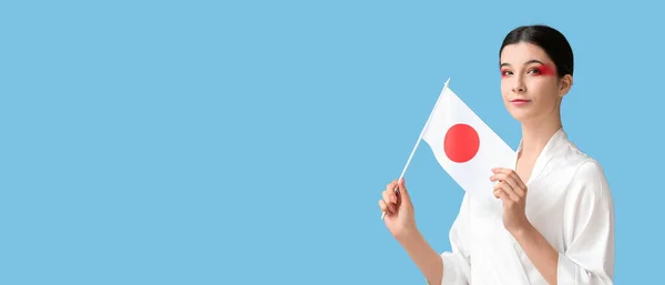 Beautiful Young Woman Holding Flag Japan Blue Background Space Text — стокове фото