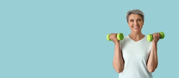 Sporty Mature Woman Holding Dumbbells Light Blue Background Space Text — Stock Photo, Image