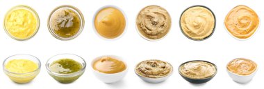 Set of different tasty sauces in bowls on white background