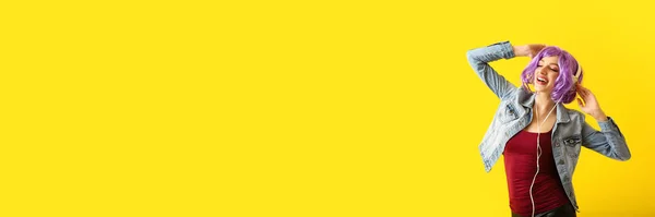 Happy Dancing Young Woman Bright Wig Headphones Yellow Background Space — Foto de Stock