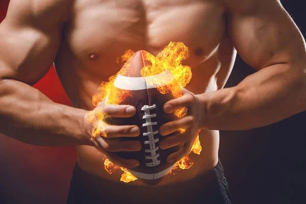 Muscular Man Burning Rugby Ball Dark Background Closeup — Stockfoto