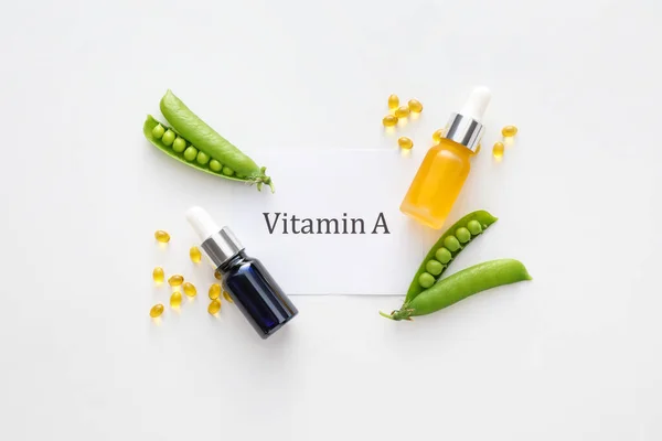 Bottles Essential Oil Capsules Green Peas Paper Sheet Text Vitamin — Stockfoto