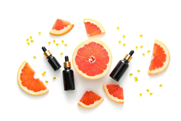 Bottles Essential Oil Vitamin Capsules Grapefruit Slices White Background — 스톡 사진