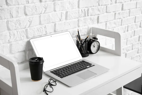 Modern Laptop Paper Cup Coffee Table White Brick Wall — Zdjęcie stockowe