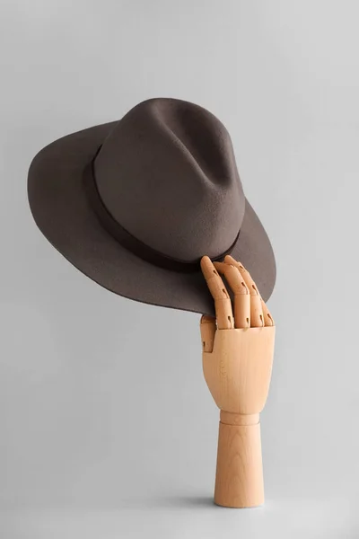 Wooden Mannequin Holding Fedora Hat Grey Background — Stockfoto