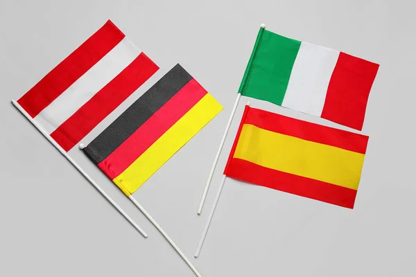 Different Flags Grey Background Closeup — Stockfoto