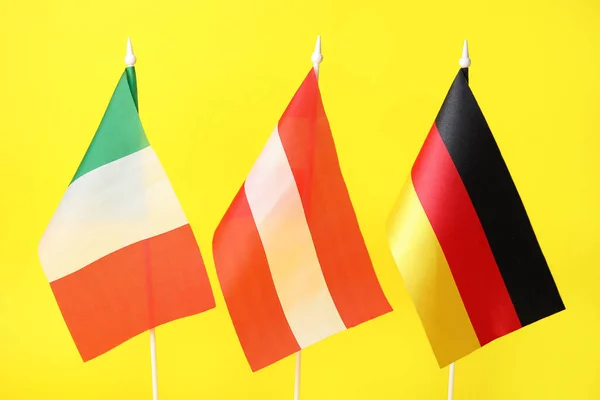 Flags Italy Austria Germany Yellow Background Closeup — Stockfoto