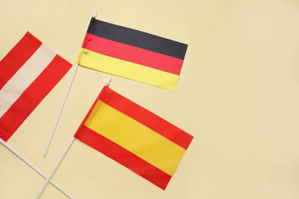 Flaggor Tyskland Österrike Och Spanien Beige Bakgrund Närbild — Stockfoto