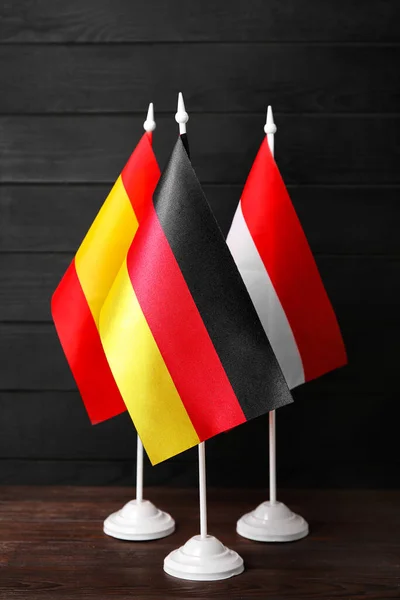 Flags Germany Spain Austria Dark Wooden Background — Stockfoto