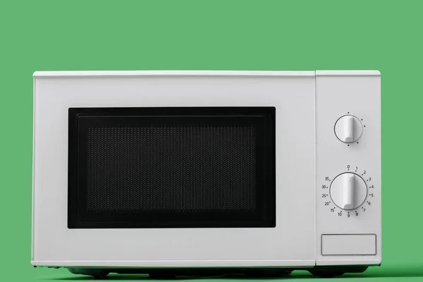 White Microwave Oven Green Background — Photo