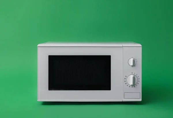 White Microwave Oven Green Background — Stock Photo, Image